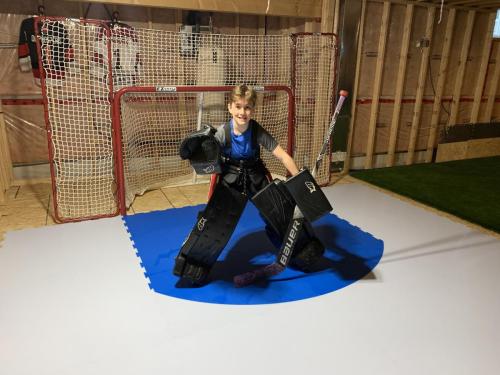 Young-goalie-training on SmartRink ProFast-8 synthetic ice goal crease